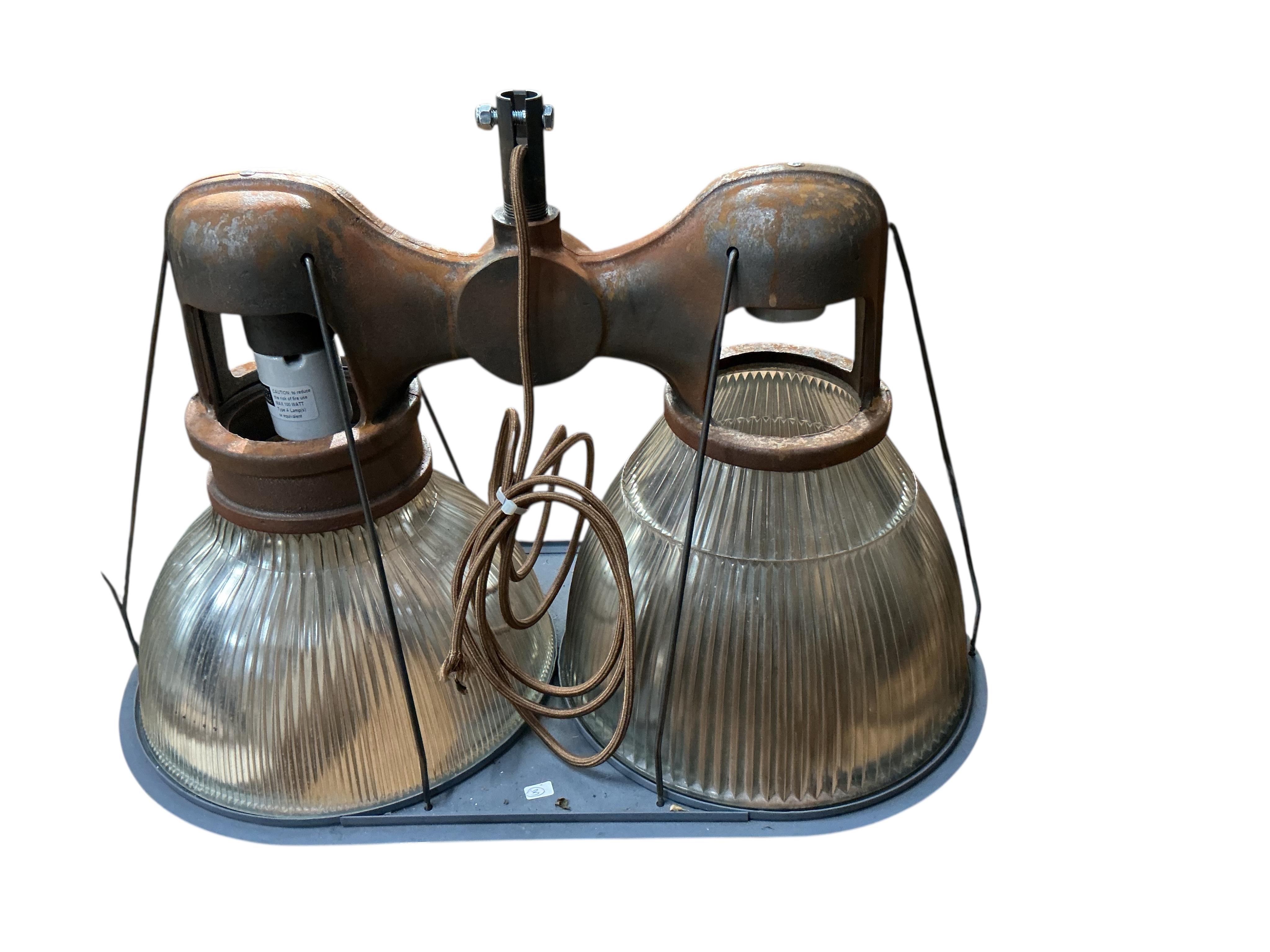 A pair of Holophane double industrial factory lights, width 64cm, height 42cm